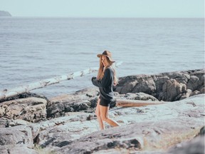 A model wears the Tucker Sweater from Gentle Fawn.