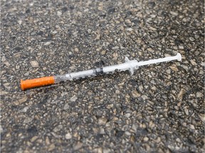 File photo of a discarded syringe: The B.C. capital has been plagued by repeated incidents of needles either discarded carelessly or deliberately placed to inflict harm.