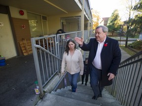Poverty-reduction minister Shane Simpson tours Stamps Place, a low-income Vancouver housing project where he lived as a child, in October 2017.