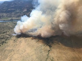 Firefighters are battling a rapidly spreading fire near Kamloops.