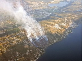 Smoke rises from a wildfire north of McKinley Landing on the east side of Okanagan Lake on Sunday, July 16, 2017.