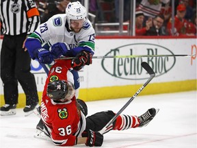 Vancouver defenceman Alex Edler, shown levelling Matthew Highmore of the Chicago Blackhawks last year, will be the Canucks' defensive workhorse when the 2018-19 NHL season starts.
