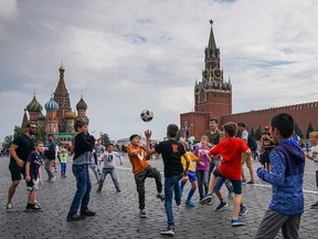 Young football fans from across the world play football in Red Square ahead of the World Cup semi-final game between England and Croatia on July 9, 2018 in Moscow, Russia.