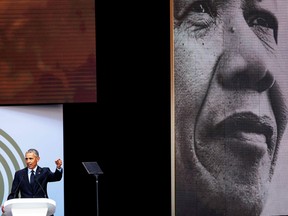 Former U.S. President Barack Obama speaks during the 2018 Nelson Mandela Annual Lecture at the Wanderers cricket stadium in Johannesburg on July 17, 2018.