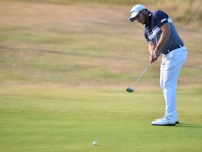 South Africa's Zander Lombard putts on the 13th green during his second round on day 2 of The 147th Open golf Championship at Carnoustie, Scotland on July 20, 2018.
