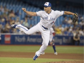 Toronto Blue Jays pitcher Seunghwan Oh throws against the Minnesota Twins in the ninth inning of their American League MLB baseball game in Toronto on Tuesday July 24, 2018.