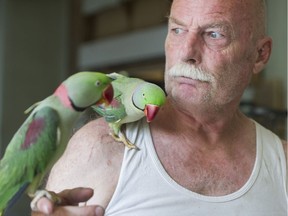 Sophus Kelly in his East Vancouver home, which he shares with 65 parrots.