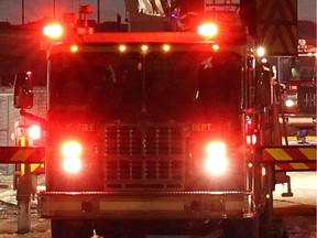 Two people needed to be rescued from the upper floor of an apartment building in Kamloops as flames raced through one room of the converted hotel.