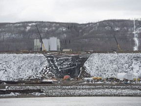 The Site C Dam location is seen along the Peace River in Fort St. John, B.C., on April 18, 2017. British Columbia's mammoth Site C hydro-electric project is seriously behind schedule, plagued by quality problems and marked by secrecy, says an assessment by an international dam expert.