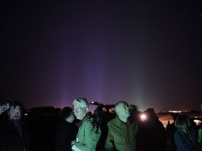 A group of attendees gather in a desert area for UFO sightings at the Annual International UFO Congress Convention Convention & Film Festival in Laughlin, Nev., on February 26, 2009. Hovering lights in the sky. Pulsing lights. A humming noise. Objects shaped like spheres, discs, triangles and boomerangs. The witnesses include ordinary folk, airline crews, a particle physicist and an airport's weather observer. A survey released by Manitoba-based Ufology Research on Tuesday says there were 1,101 UFO sightings -- an average of three a day -- reported in Canada in 2017.