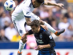 Vancouver Whitecaps' Sean Franklin, top, and San Jose Earthquakes' Chris Wondolowski vie for the ball during second half MLS soccer action in Vancouver on May 16, 2018. All friendships will be left on the sidelines this weekend when the Vancouver Whitecaps take the pitch in Washington, D.C.For Whitecaps defender Sean Franklin, Saturday's match will be somewhat of a homecoming. The 33-year-old played four seasons with D.C. United before signing with the Whitecaps in February.