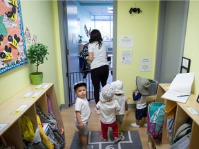Children prepare to go outside at a CEFA (Core Education and Fine Arts) Early Learning daycare franchise, in Langley, B.C., on Tuesday May 29, 2018.