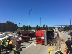 A rolled semi-truck has blocked the southbound lanes of the Knight Street Bridge near the north end of the span. The bridge is pictured in this 2014 file photo.