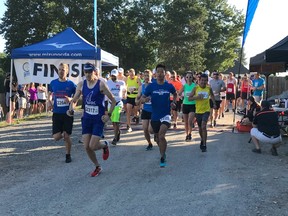 Drew NIcholson of Surrey, in bib 2317, took an early lead in Sunday's 15th PEN RUN Fort Langley Half Marathon and 5K and never looked back. A winner in 2009, Nicholson easily won Sunday's race. More than 300 people competed in the event.