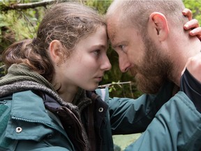Thomasin Harcourt McKenzie (left) and Ben Foster in a scene from Leave No Trace.