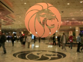 ** HOLD FOR STORY ** FILE ** The MGM logo is seen at the main entrance of MGM Grand hotel-casino in Las Vegas in this Feb. 22, 2006 file photo. The operator of the Mandalay Bay casino-resort from which a gunman carried out the largest mass shooting in U.S. history has filed federal lawsuits against hundreds of victims. MGM Resorts International argues in lawsuits filed Friday, July 13, 2018 in Nevada and California that it is has "no liability of any kind" to the defendants under a federal law enacted in the wake of 9/11 terrorist attacks.
