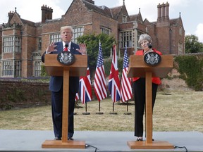 President Donald Trump with British Prime Minister Theresa May during their joint news conference at Chequers, in Buckinghamshire, England, Friday, July 13, 2018.
