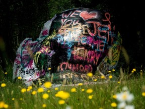 For decades, a boulder perched above Interstate 5 about six kilometres south of Bellingham has served as the community's billboard — a public spot on the side of the road to paint messages of celebration, love and loss.
