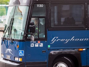 A worker moves a Greyhound bus after it was washed, in Vancouver, on Monday July 9, 2018. The federal NDP is urging Prime Minister Justin Trudeau to develop a funding plan that would preserve Greyhound Canada's bus routes in northern communities. NDP Leader Jagmeet Singh asks Trudeau in a letter to take "immediate action" and stop the cancellation of crucial bus routes in Manitoba, Saskatchewan, Alberta, Northwestern Ontario and rural British Columbia.
