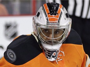Philadelphia Flyers' Ray Emery watches a deflected shot fly by during the first period of an NHL hockey game against the Boston Bruins, Saturday, Jan. 10, 2015, in Philadelphia. Hamilton police say former NHL goalie Ray Emery has drowned in Lake Ontario. Police say Emery's death does not appear to be suspicious, calling it a "case of misadventure."