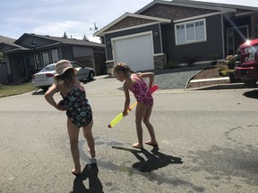 Chalk drawings and water-play in Artisan Gardens, the Chemainus B.C. neighbourhood that has declared a war on fun.