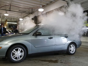 FILE - In this April 16, 2015 file photo, smoke created by water vapor billows out of the windows of a car, used by Colorado to fight stoned driving with youth demographics, during a demonstration by the Colorado Department of Transportation in southeast Denver. The Highway Loss Data Institute, a leading insurance research group, said in 2017 study that collision claims in Colorado, Washington, and Oregon went up 2.7 percent in the years since legal recreational marijuana sales began when compared with surrounding states.