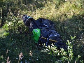 A heavily damaged Kawasaki Ninja motorcycle is shown in this RCMP handout image. Mounties in Prince George, B.C., say they are looking for a man who left a woman behind after the motorcycle the pair was on skidded along a road and over an embankment.