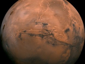 FILE - This image made available by NASA shows the planet Mars. This composite photo was created from over 100 images of Mars taken by Viking Orbiters in the 1970s. On Tuesday, July 31, 2018, the red planet will make its closest approach to Earth in 15 years. (NASA via AP)