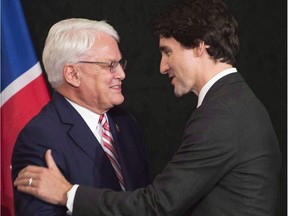 Former B.C. Premier Gordon Campbell, left, shown here with Prime Minister Justin Trudeau, was one of three panelists named by new Ontario Premier Doug Ford to help review the provincial finances and accounting inherited from the previous Ontario Liberal government.