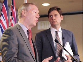 Attorney General David Eby holds a news conference to discuss an independent review of anti-money laundering practices and report author Peter German provides an overview of recommendations in Vancouver, BC. June 27, 2018.