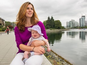 Jessica Pautsch Regan, holding three-month-old daughter Davina at False Creek, has set up FoodMesh, a program that delivers food that would otherwise be wasted to charities and businesses.