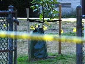 Vancouver Police on the scene of the city's 12th homicide of the year on the grounds of Tillicum Community Annex school at Cambridge St and Nanaimo St, in Vancouver, BC., July 26, 2018.  According to Vancouver police, the shooting occurred just before 8 p.m. when officers found the man suffering from gunshot wounds. He was rushed to hospital and died a short time later. (NICK PROCAYLO/PostMedia)   00054115A ORG XMIT: 00054115A [PNG Merlin Archive]