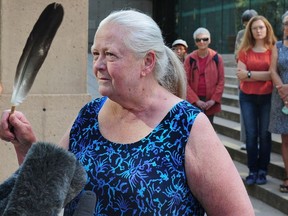 Laurie Embree, one of two people sentenced on Tuesday to a week in jail for violating the injunction at a Burnaby Kinder Morgan site, speaks before her court hearing.