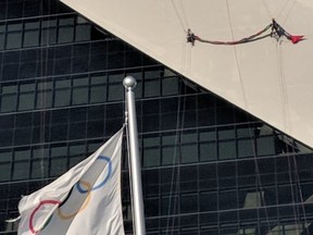 Greenpeace activists climbed Montreal's Olympic Stadium on July 19, 2018 to protest the Trudeau government's purchase of the Trans Mountain pipeline. Photo Greenpeace Canada/Twitter