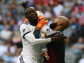 Vancouver Whitecaps' Kei Kamara (23) heads the ball against Colorado Rapids goalkeeper Tim Howard (1) during first half MLS soccer action in Vancouver on Sunday, July 1, 2018.