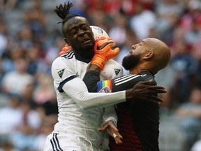 Vancouver Whitecaps' Kei Kamara (23) heads the ball against Colorado Rapids goalkeeper Tim Howard (1) during first half MLS soccer action in Vancouver on Sunday, July 1, 2018.