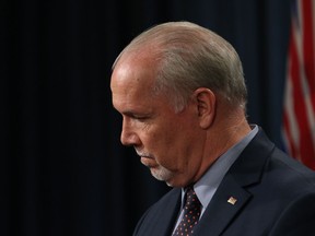Premier John Horgan says he continues to receive calls for a public inquiry into the "Dirty Money" report, but he says the cost and time spent on doing that may not reveal the answers anyway.