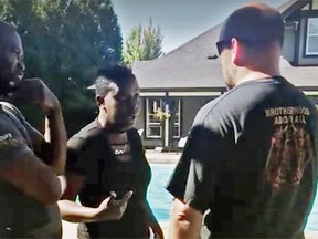 Image of Guerda Henry (centre) during a confrontation at the pool in her townhouse complex in Surrey on July 12, from a video she posted to Facebook.