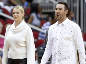 FILE - In this April 5, 2018, file photo, model Kate Upton and her husband, Houston Astros pitcher Justin Verlander attend an NBA basketball game between the Portland Trail Blazers and the Houston Rockets in Houston. Upton and Verlander are expecting their first child.  Upton announced the pregnancy on Instagram on Saturday, July 14, 2018, in a post with the hashtag "pregnant in Miami" where she tagged Verlander.