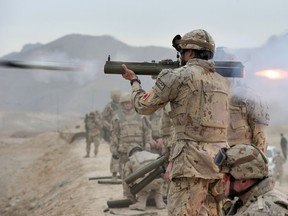 FILE PHOTO: A Canadian Armed Forces soldier fires an M72 light anti-tank weapon at the Kabul Military Training Centre range in Kabul, Afghanistan on November 4, 2013.