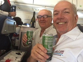 Postmedia reporter Larry Pynn with B.C. Premier John Horgan on flight from Toronto to Vancouver.