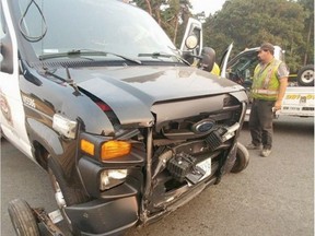 This Victoria police van was struck by a car at Cook Street and Dallas Road early Tuesday. An officer was injured.