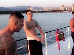 Matthew Alexander Navas-Rivas (centre) enjoyed a boat cruise around Vancouver last month, just a day before he was killed.