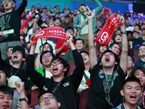 PSG.LGD fans celebrate a they watch the match between PSG.LGD and Team Liquid on Day 3 of The International 2018 Dota 2 Championships at Rogers Arena on August 22, 2018 in Vancouver, Canada. PSG.LGD defeated Team Liquid 2-0.