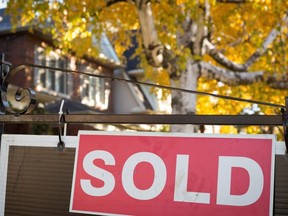 A real estate sold sign hangs in front of a west-end Toronto property.