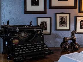 An old manual typewriter also stands atop Irena Karafilly's oval table tucked into an alcove underneath her bookshelves in the living room in her Montreal home, on Wednesday, November 1, 2017