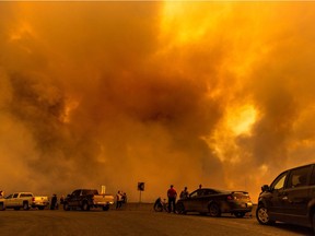 Folks viewing the power of the Island Lake fire from Francois Lake Road.