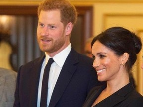 Britain's Prince Harry, Duke of Sussex, (C) and Britain's Meghan, Duchess of Sussex (2R) talk with US composer and writer Lin-Manuel Miranda (L) and other guests as they arrive to attend a gala performance of the musical 'Hamilton' in support of the charity Sentebale at the Victoria Palace Theatre in London on August 29, 2018.