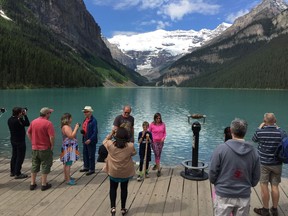 Visitors line up to take photos at Lake Louise in Banff National Park in late June 2016.