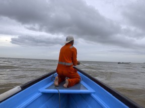 A fisherman on July 12, 2018, rides in a boat where some have been either robbed and/or killed by Venezuelan pirates or had their livelihoods of fishing affected by the increasing criminality of piracy on the waters between Venezuela and Trinidad.